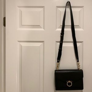 Rebecca Minkoff black structured crossbody with 3 compartments.